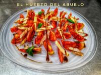 a plate of food with vegetables on a table at Casa Rural, Spa y restaurante El Huerto del Abuelo in Almiruete
