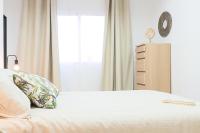 A bed or beds in a room at AT Trajano 6