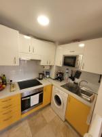 Kuchyň nebo kuchyňský kout v ubytování Apartament CALETA