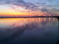 a large body of water with a sunset in the background at Maison Les Sables-d&#39;Olonne, 4 pièces, 6 personnes - FR-1-92-798 in Les Sables-d&#39;Olonne