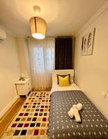 Apartamentos Prestige Suites Málaga IIIにあるベッド