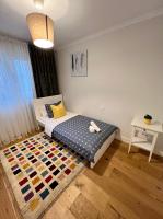 Apartamentos Prestige Suites Málaga IIIにあるベッド
