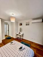 Apartamentos Prestige Suites Málaga IIIにあるベッド