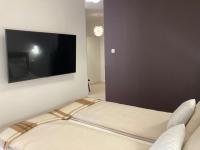 Postel nebo postele na pokoji v ubytování Apartamenty Na Tatarskiej 4A