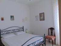 A bed or beds in a room at N019 - Numana, prestigioso quadrilocale vista mare