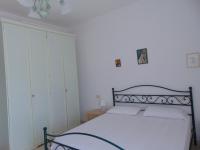 A bed or beds in a room at N019 - Numana, prestigioso quadrilocale vista mare