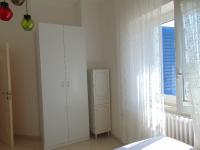 A bed or beds in a room at N019 - Numana, prestigioso quadrilocale vista mare