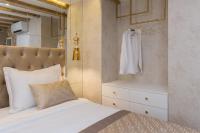 Posteľ alebo postele v izbe v ubytovaní Le Premier Luxury Rooms
