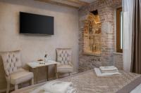 Posteľ alebo postele v izbe v ubytovaní Le Premier Luxury Rooms