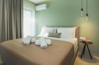 Posteľ alebo postele v izbe v ubytovaní Celine Luxury Apartments & Suites