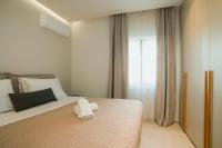 Posteľ alebo postele v izbe v ubytovaní Celine Luxury Apartments & Suites