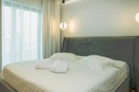 Posteľ alebo postele v izbe v ubytovaní Celine Luxury Apartments & Suites