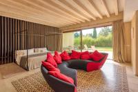a living room with a couch and a bed at Hotel Rural Xereca in Puig D’en Valls