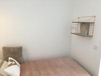 a room with a bed and a chair and a mirror at Studio Merville-Franceville-Plage, 1 pièce, 3 personnes - FR-1-487-222 in Merville-Franceville-Plage