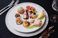 um prato com uma variedade de alimentos sobre uma mesa em Hotel Oxford By TimHotels em Timişoara