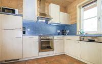 a kitchen with white cabinets and a stove top oven at Lovely Home In Dalaas With Kitchen in Dalaas