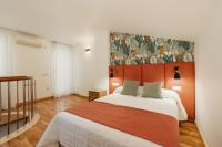 Posteľ alebo postele v izbe v ubytovaní Apartamentos Debambú