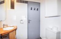 a white bathroom with a shower and a sink at Amazing Apartment In Saint Cyprien Plage With Wifi in Saint-Cyprien-Plage
