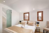 Posteľ alebo postele v izbe v ubytovaní Le Premier Luxury Rooms