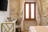Posteľ alebo postele v izbe v ubytovaní Le Premier Luxury Rooms