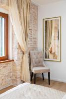 Posteľ alebo postele v izbe v ubytovaní Le Premier Luxury Rooms
