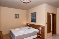 Posteľ alebo postele v izbe v ubytovaní Tatragolf Mountain Resort