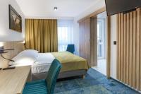 Posteľ alebo postele v izbe v ubytovaní Hotel Gromada Łomża