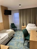 Posteľ alebo postele v izbe v ubytovaní Hotel Gromada Łomża