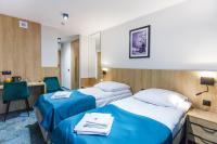 Posteľ alebo postele v izbe v ubytovaní Hotel Gromada Łomża