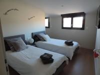 Posteľ alebo postele v izbe v ubytovaní Agréable maison de village avec garage & terrasse