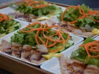 a tray filled with different types of food on plates at Moana Breeze Rangiroa - Rental car included - Air conditioning - WI-Fi in Tiputa