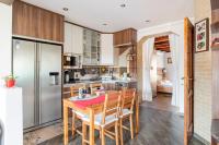 A kitchen or kitchenette at Erika's House.
