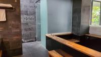 a bathroom with a sink and a shower at Fu Wan Cafe Villa in Donggang