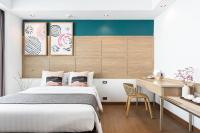 Postel nebo postele na pokoji v ubytování Darley Hotel Chiangmai