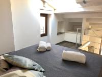 A bed or beds in a room at Marechiaro House