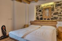 A bed or beds in a room at VILLAGGIO VAL MOLINI