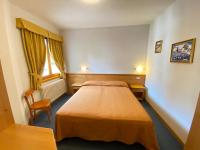 A bed or beds in a room at Residence Sci Sport