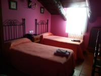A bed or beds in a room at Hostal Venta Liara