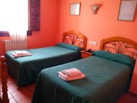 A bed or beds in a room at Hostal Venta Liara