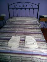 A bed or beds in a room at Hostal Venta Liara