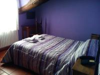 A bed or beds in a room at Hostal Venta Liara