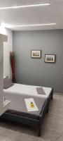 a bedroom with a bed with a banana on it at Skiathos Holiday Resort in Skiathos