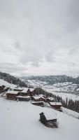 a group of buildings in the snow on a mountain at Bergdorf Hotel Zaglgut in Kaprun