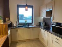 Kuchyňa alebo kuchynka v ubytovaní Sunny Life Apartment