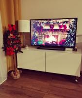 Televízia a/alebo spoločenská miestnosť v ubytovaní Apartament Olecko Centrum