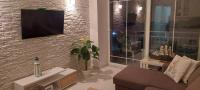A television and/or entertainment centre at Lovely 1-Bed Apartment in Perea