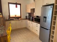 Kuchyňa alebo kuchynka v ubytovaní Sunny Life Apartment