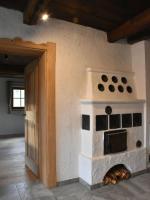 a brick oven sitting in the corner of a room at Apartment Appartment Wiesberg by Interhome in Niedernsill