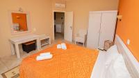 Łóżko lub łóżka w pokoju w obiekcie Ξενώνας Μενελαΐς - Menelais Apartments