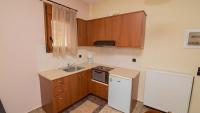 Kuchnia lub aneks kuchenny w obiekcie Ξενώνας Μενελαΐς - Menelais Apartments